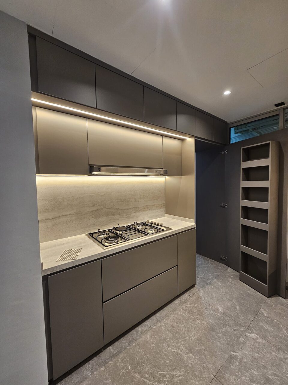 Kitchen — hob and travertine splash