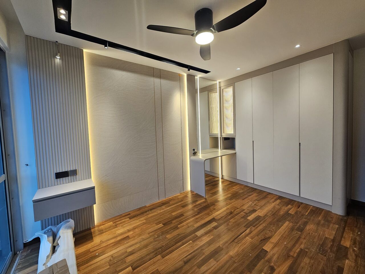 Bedroom — woodgrain feature wall and wardrobes