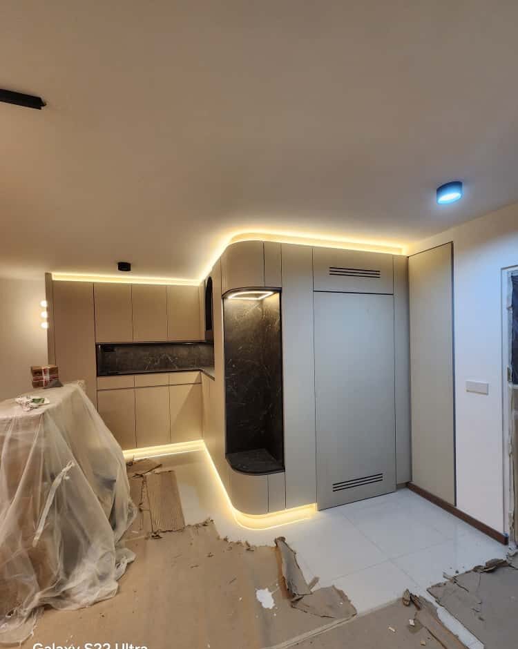 Entry — curved greige feature with marble niche