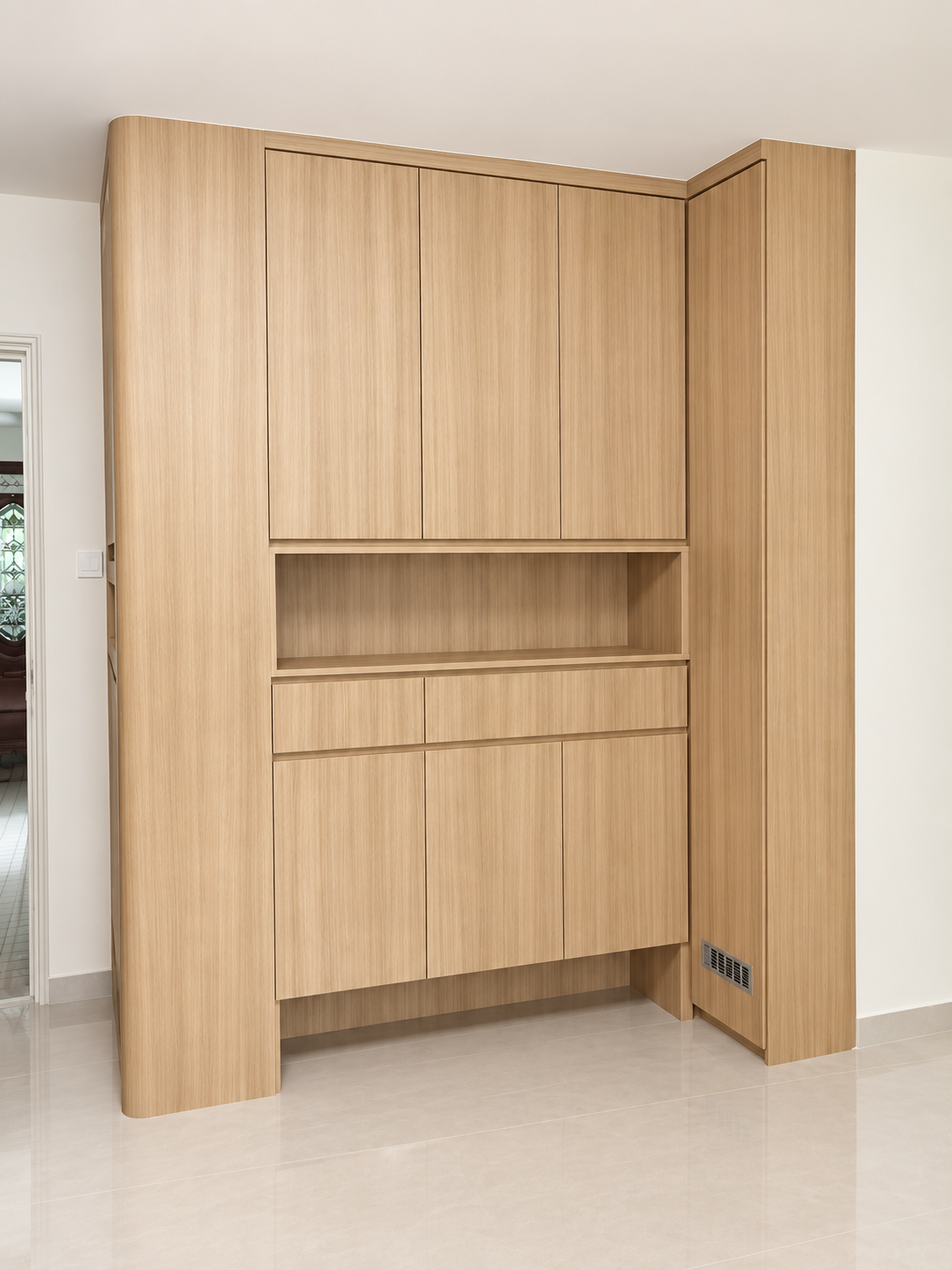 Double-tower utility pantry cabinets beside staircase
