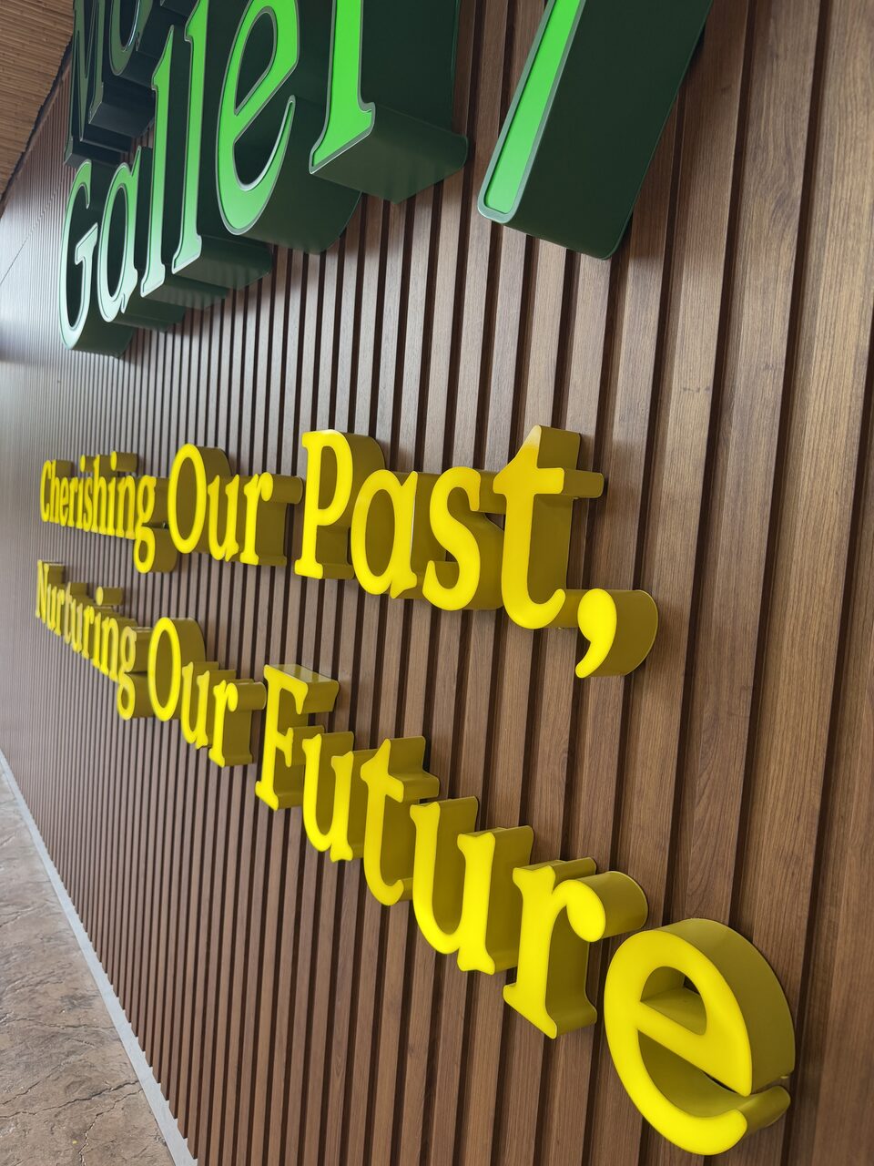 Dimensional green-and-yellow Mandai Gallery feature lettering