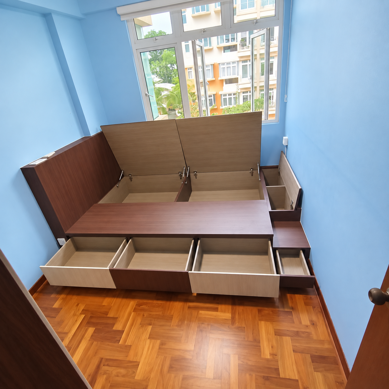 Lift-up compartments and pull-out drawers fully open, showing the storage capacity of the platform