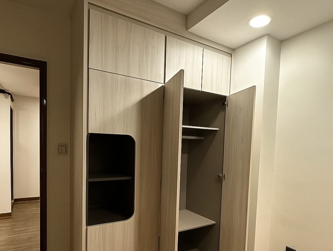 Open wardrobe showing hanging, shelves and overhead storage