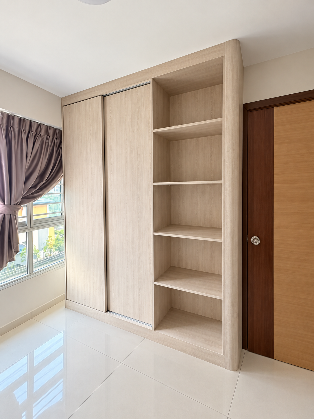 Common room built-in wardrobe with oak grain accents