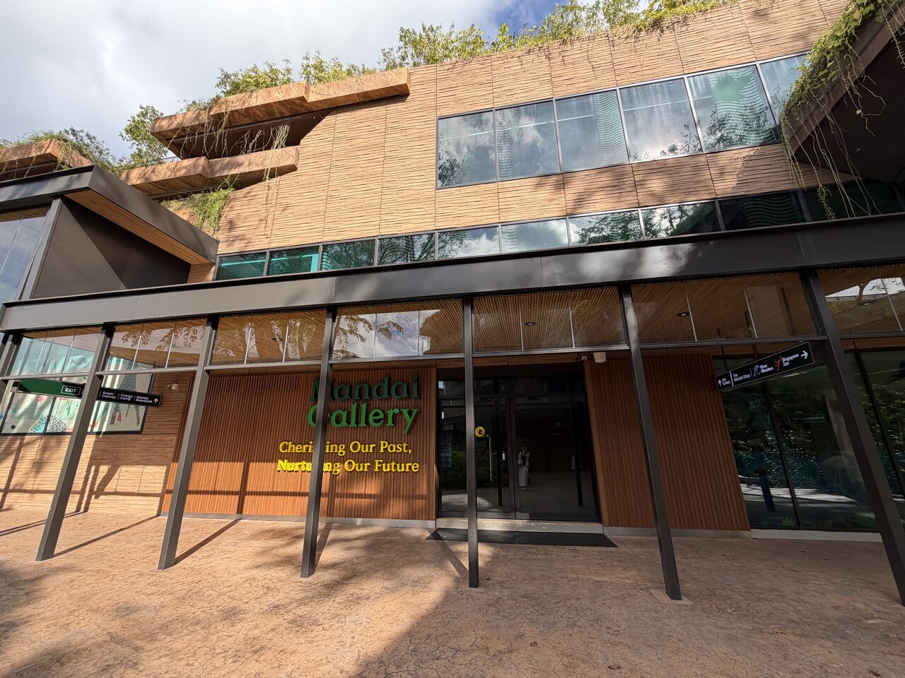 Full gallery frontage with slatted timber ceiling and green roof