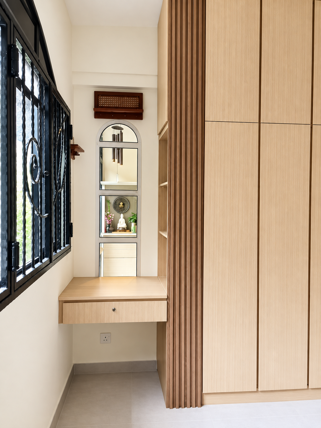 Study nook with wardrobe, floating oak desk and arched iron window