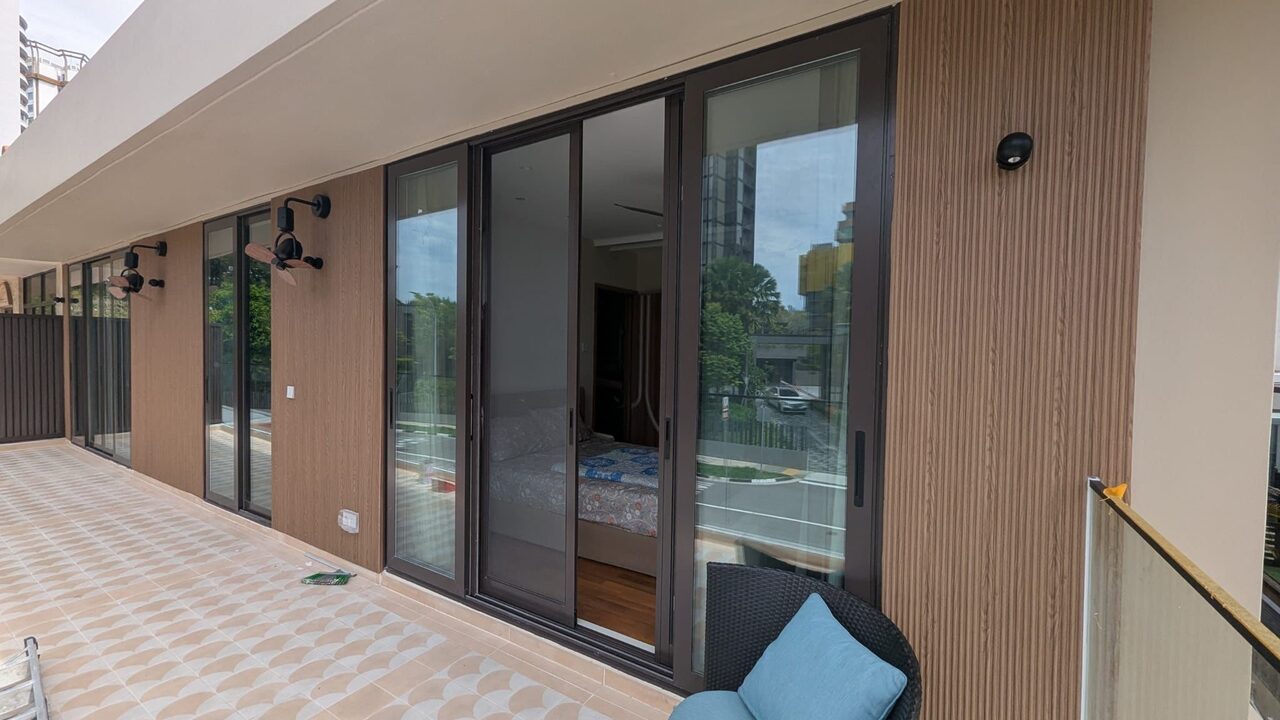 Wraparound balcony clad in timber-look fluted WPC over scallop-pattern tile