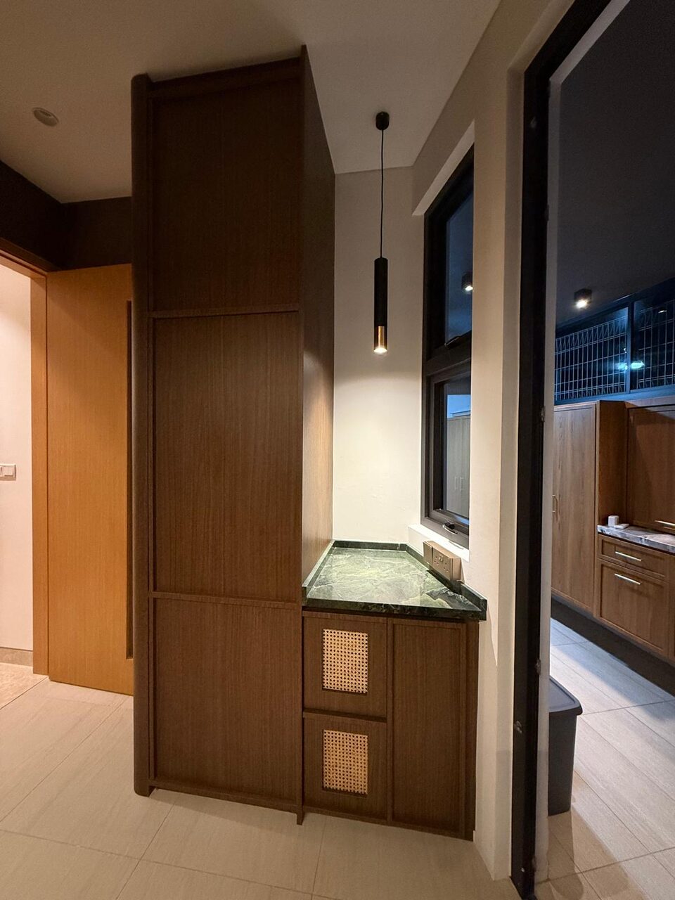 Rattan-and-marble dry counter at night
