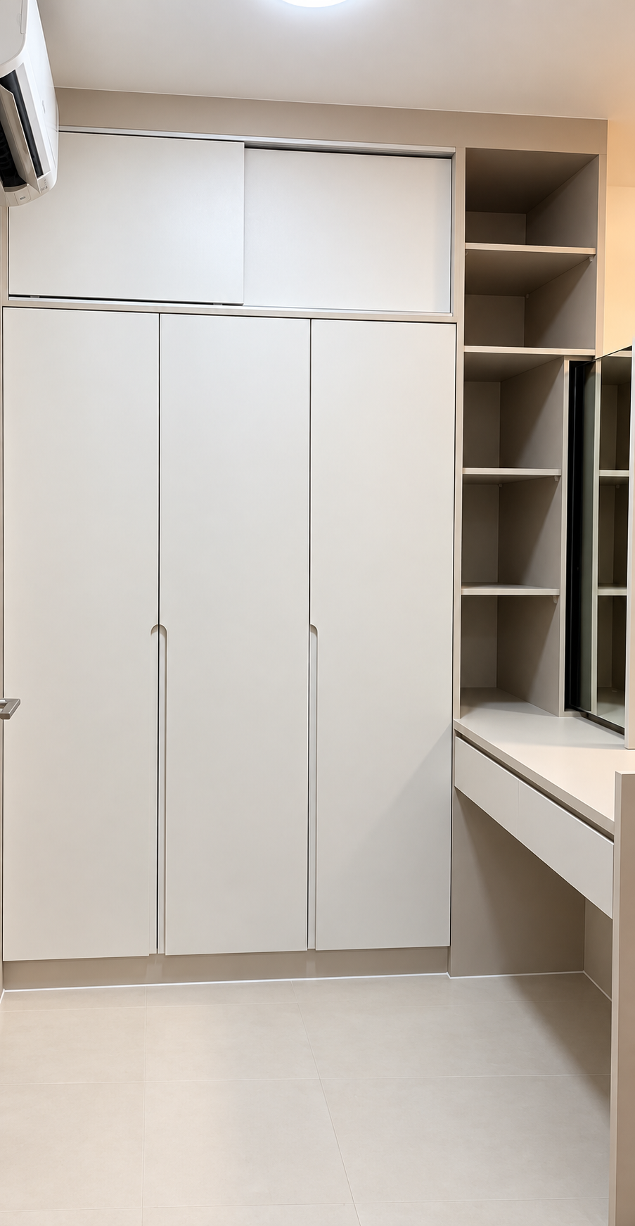 Bedroom: greige wardrobe with open display shelf tower and dressing ledge
