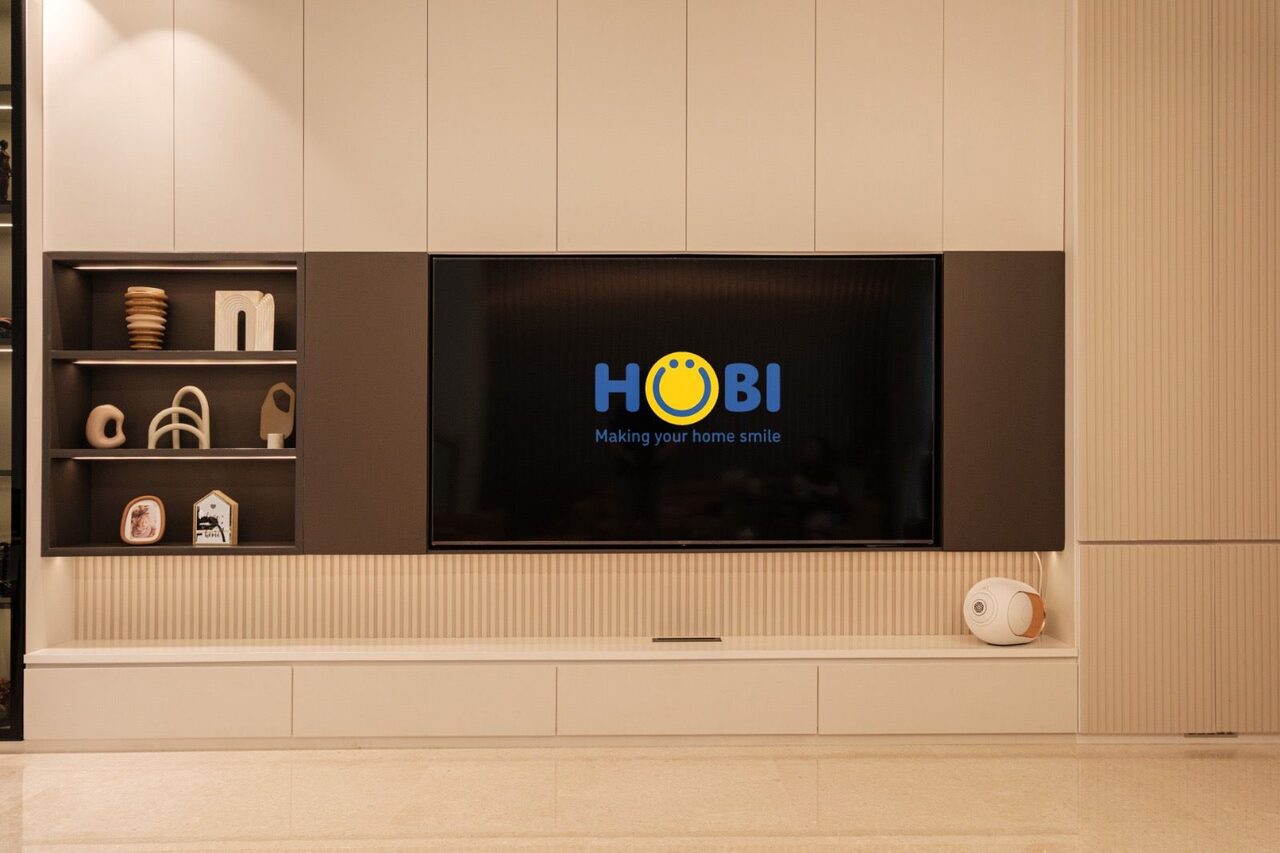 Cream living TV feature wall with lit dark display niche