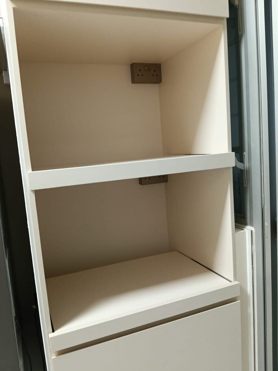 Powered open shelving with built-in sockets
