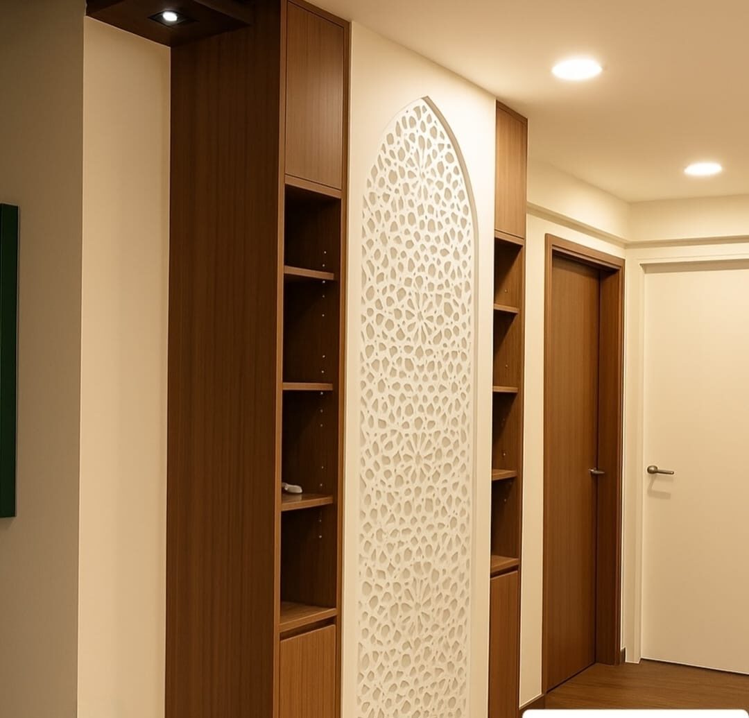 Laser-cut arabesque prayer arch framed by walnut shelving