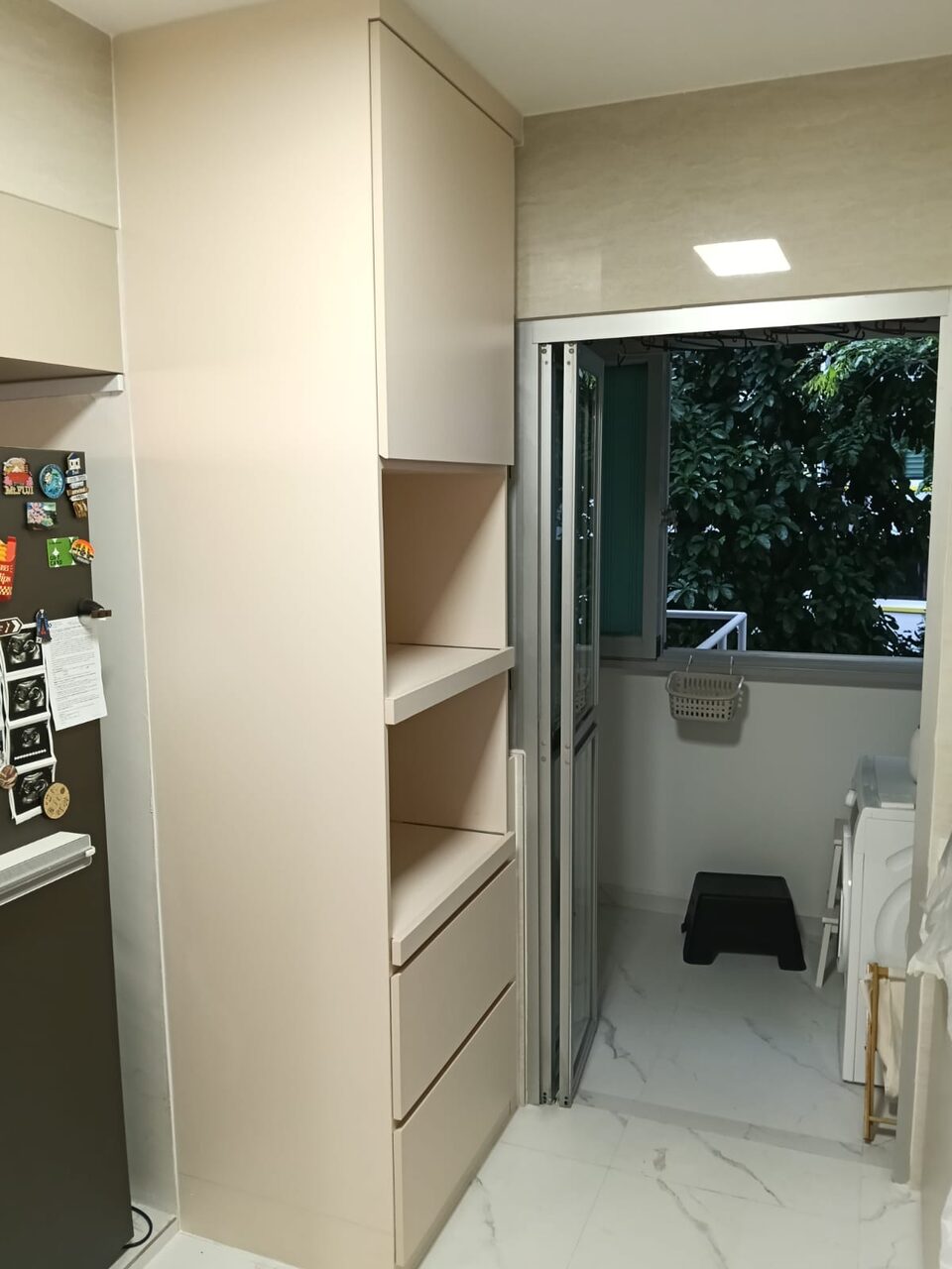 Tall greige storage cabinet by the service yard