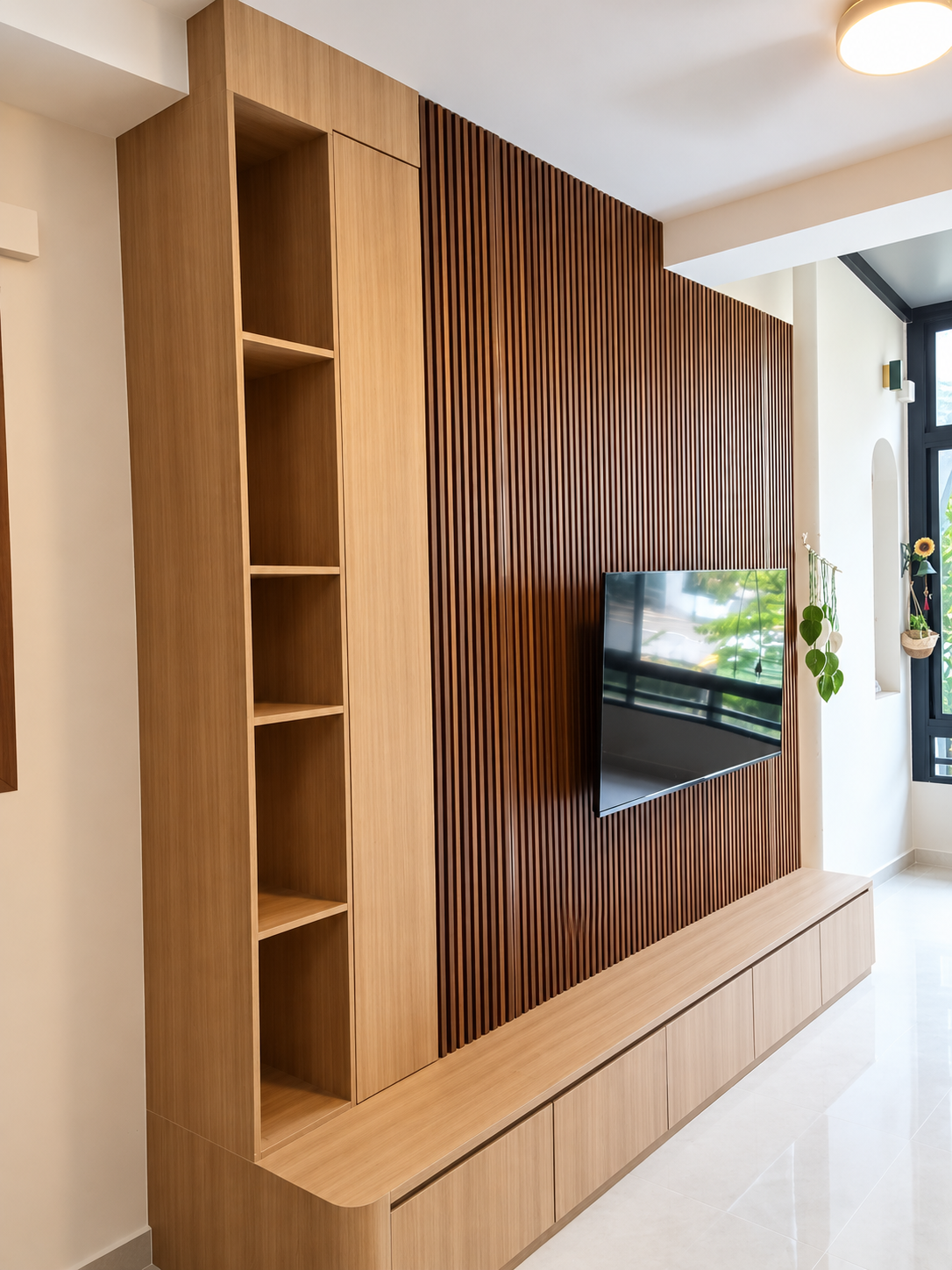TV feature wall — dark walnut fluted backing with oak shelves