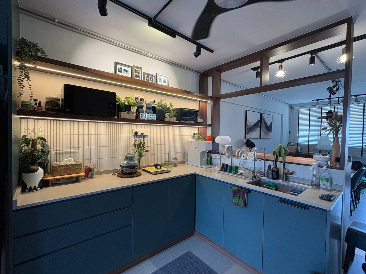 Serangoon Central HDB kitchen in petrol blue with walnut open shelves